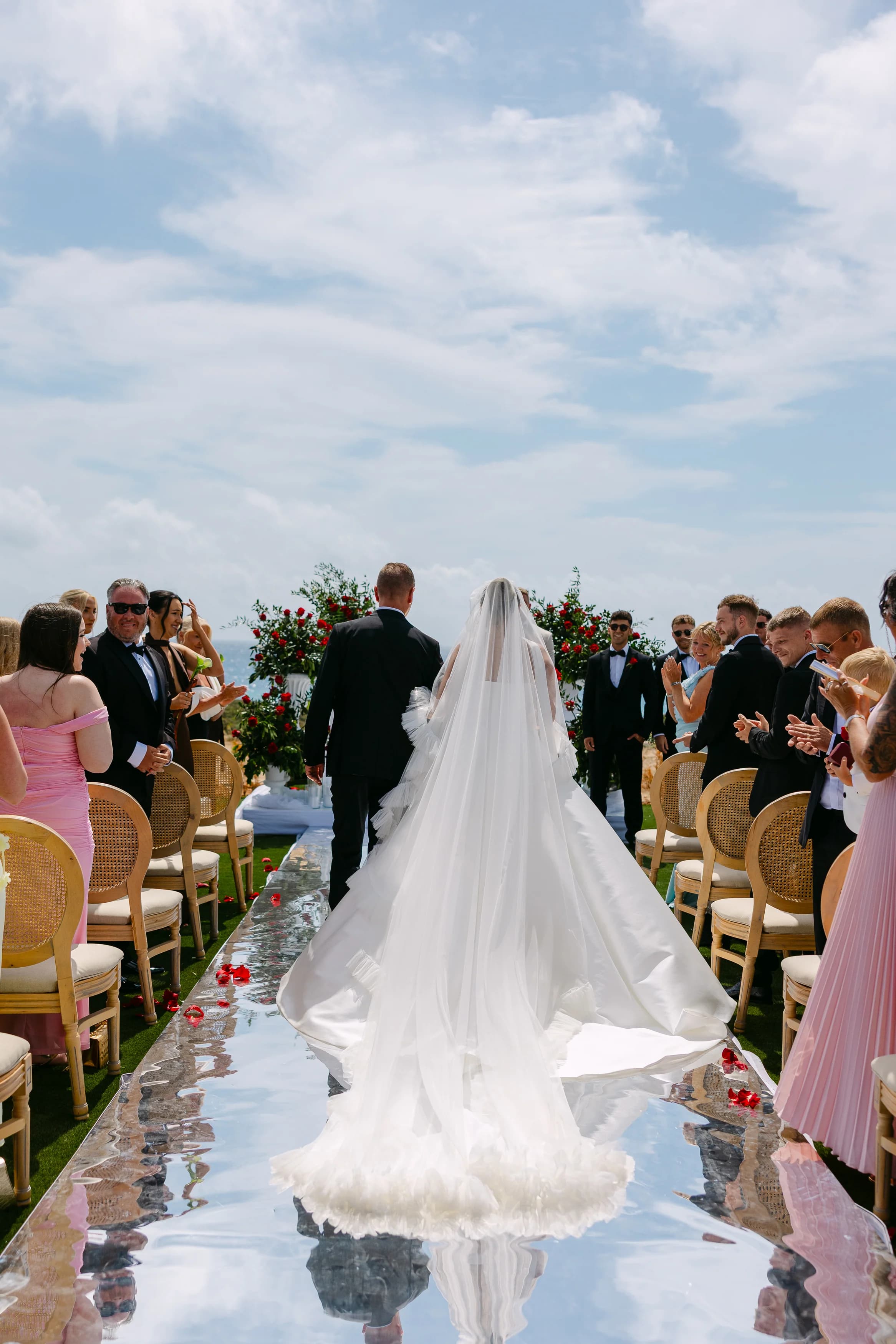 Closer view of the bride and her father walking down the aisle at Ozea.