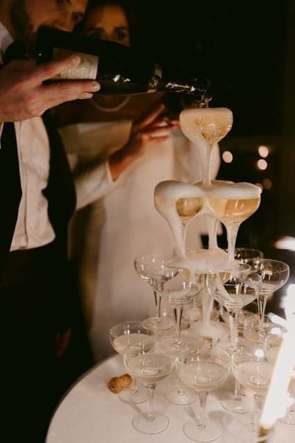 Champagne tower pour at OZEA during an evening reception.